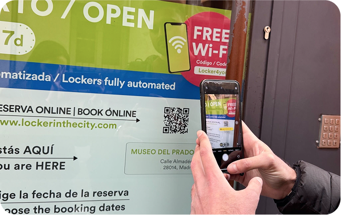 Photo of the storage facility at Atocha - Museo del Prado, Madrid with a person scanning the QR code to make a reservation