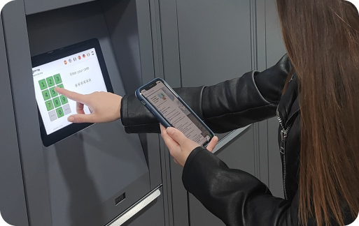 Photo of the storage facility at Gare d'Antibes | Musée Picasso, Antibes with a person using the screen to open their locker
