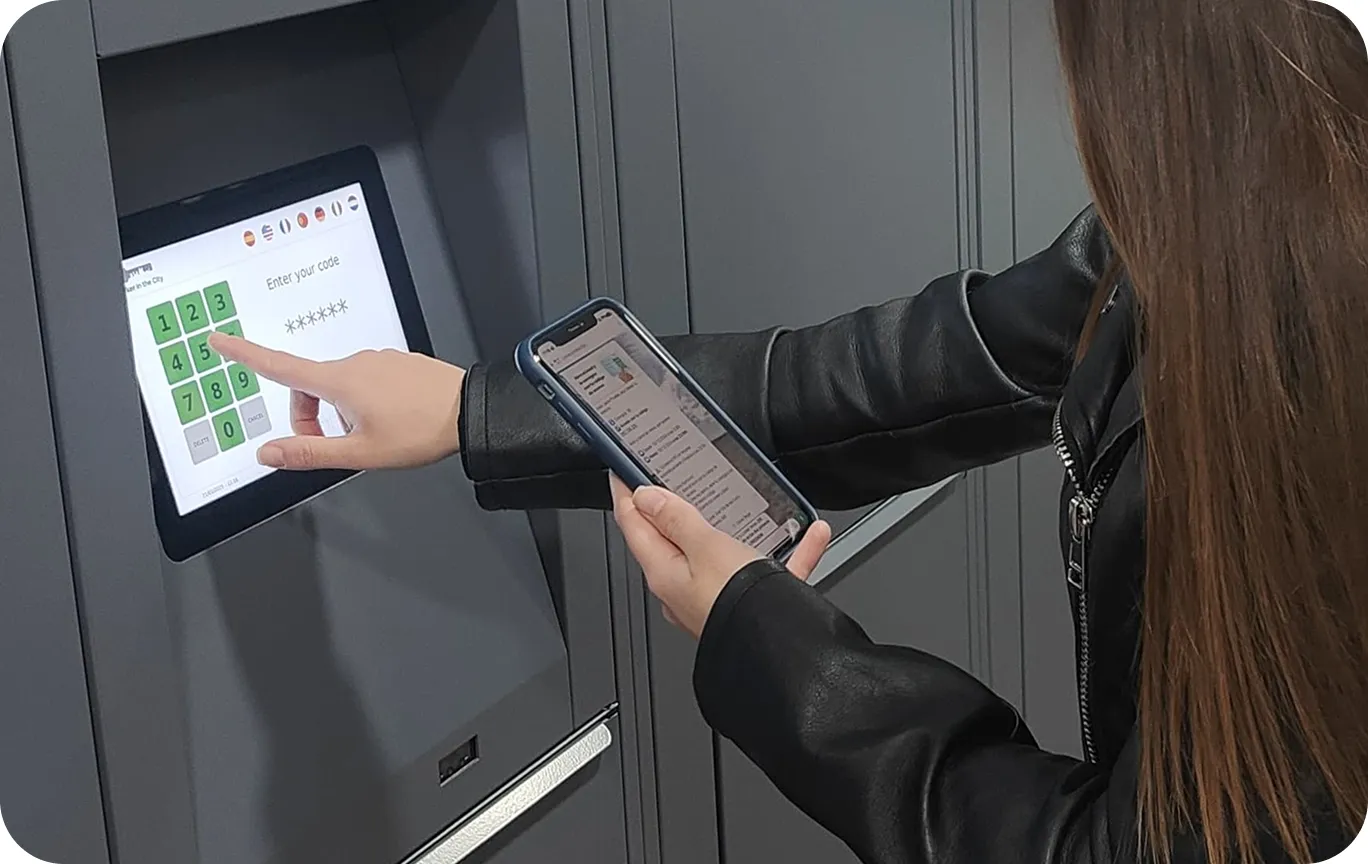 Photo of the storage facility at Museo Picasso | Alcazaba, Málaga with a person using the screen to open their locker