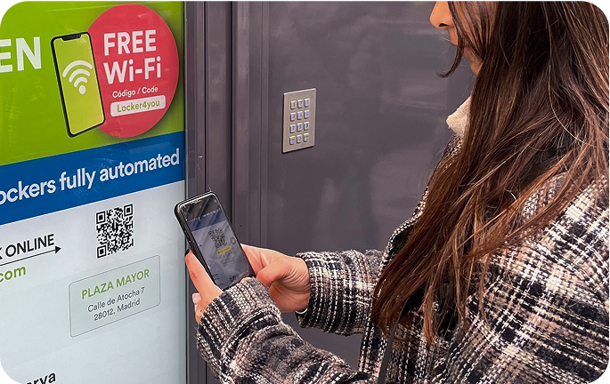 Photo of the storage facility at Plaza Mayor, Madrid with a person using the screen to open their locker